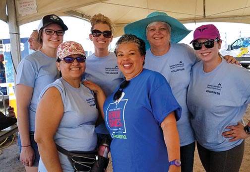 SLFCU Employees pose for a photo while volunteering at the 2019 National Senior Games